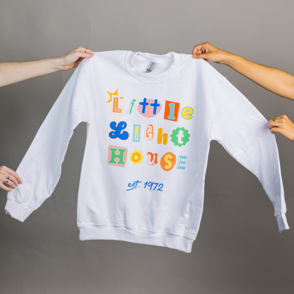 White sweatshirt that says Little Light House in a colorful design